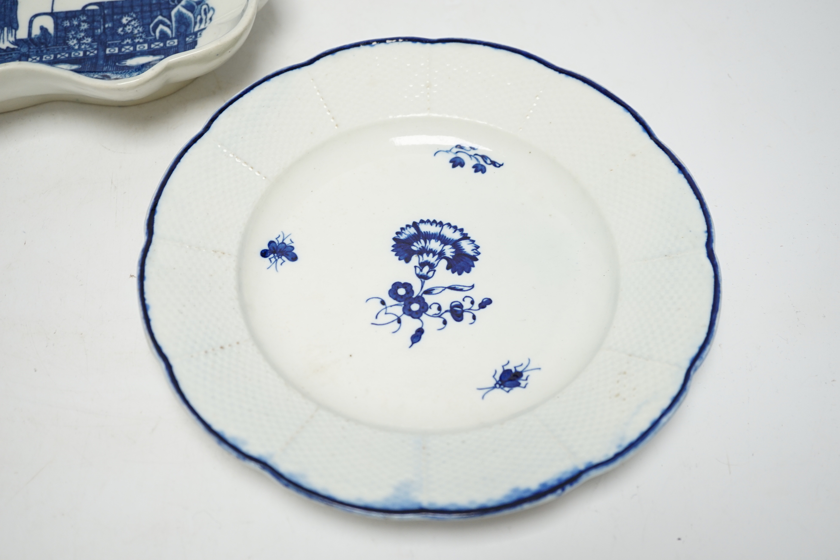 A Caughley carnation pattern plate, c.1765-70 and a fisherman pattern dessert dish c.1780, plate 21.5cm
